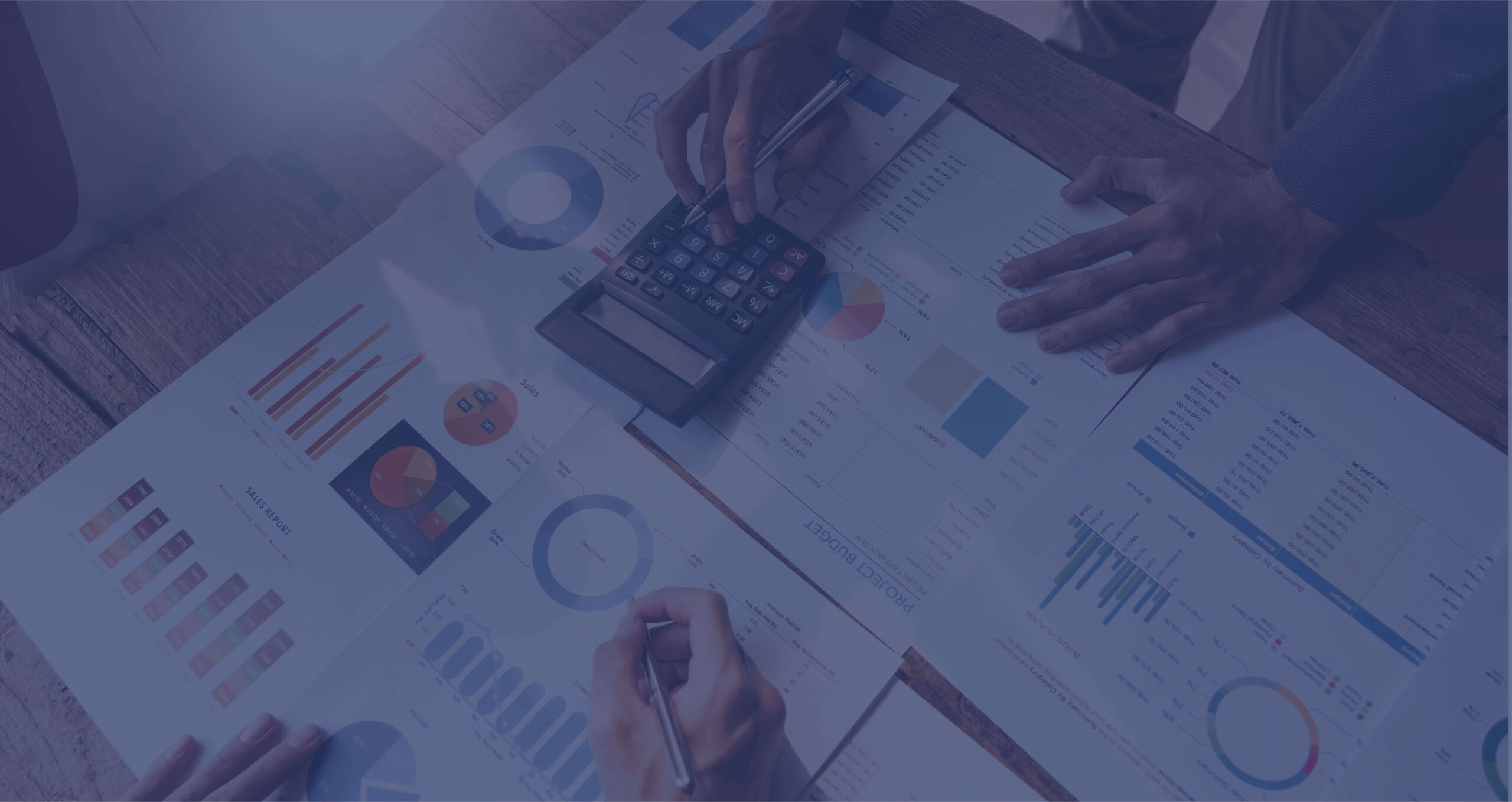 Financial reports and calculator on an accountant’s desk